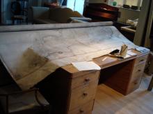 Repairs to a large early 19th century map of Britain.