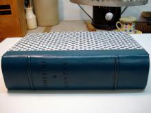 Quarter leather binding, decorative paper sides, two raised bands.