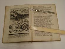 Cutting the original sewing in order to 'pull' the book.