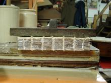 Sewn book with a layer of glue on the spine.