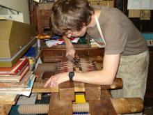 Backing the book in a laying press.