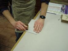 Shaping the boards to fit the book.
