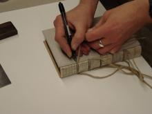 Marking the boards in position on the book.1.