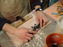 Thinning the leather with a spoke shave.