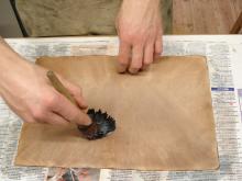 Pasting out the leather.