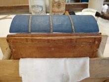 Book in press ready for new leather spine.