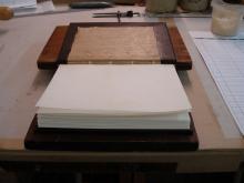 Endpapers ready to be laid down open.