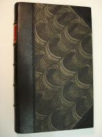 Dance of Death, bound in half leather, black morocco with paste paper sides, and a red morocco label.