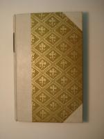 Half vellum case with decorative paper sides and a leather label.