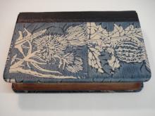 Quarter leather binding, morocco spine with block printed paste paper sides.